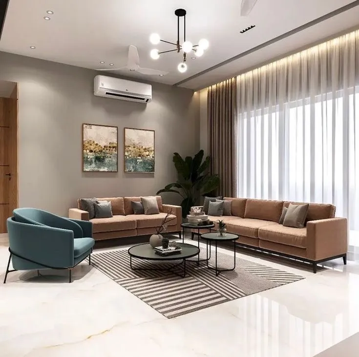 Colorful living space with camel velvet sofas and a teal accent chair