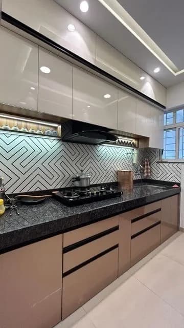 Modern kitchen featuring a striking geometric tile backsplash